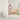 Woman and child in a nursery with Ionmax Lavish Plus air purifier on the floor.